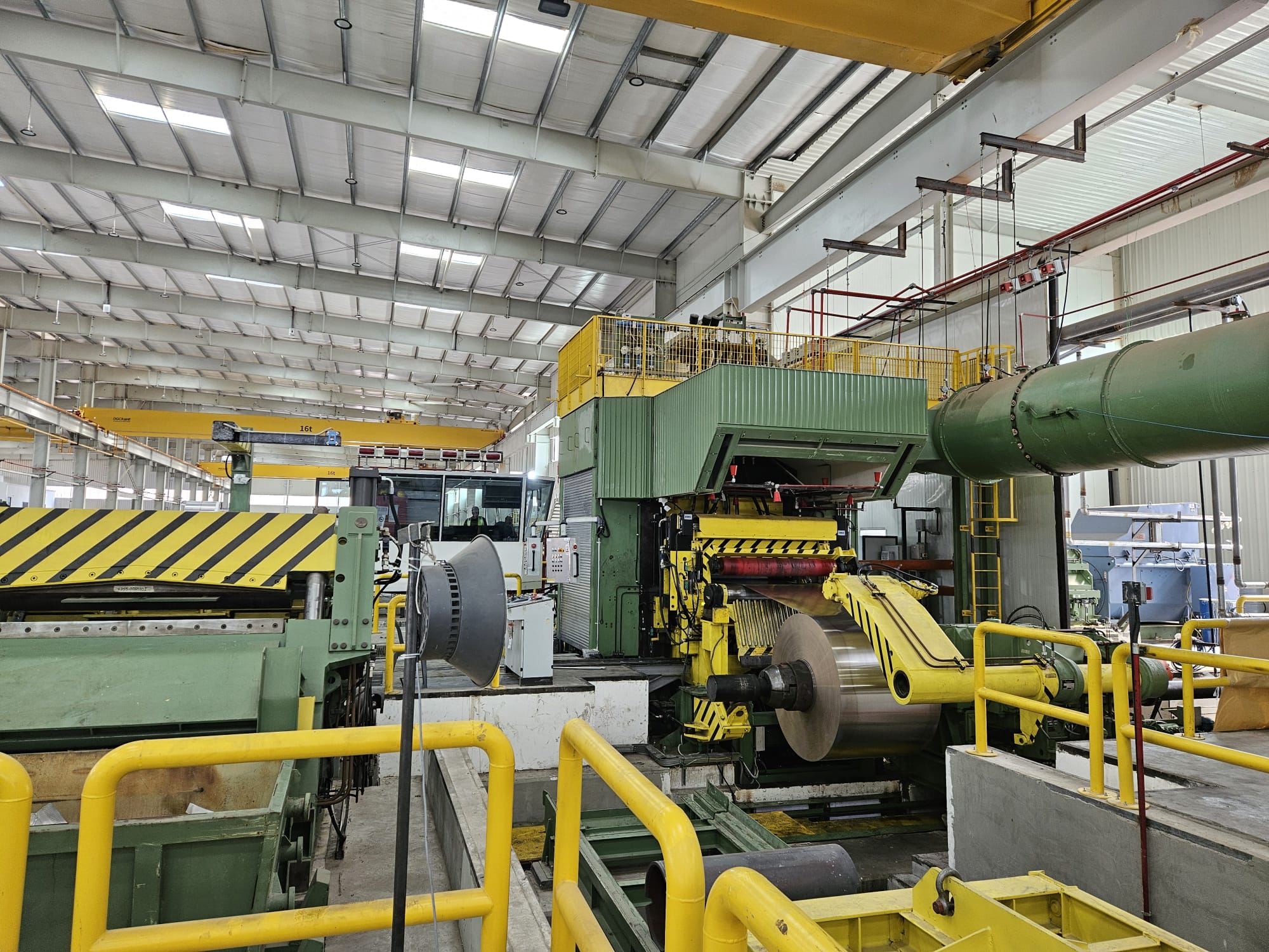 Cold rolling mill stand with an aluminum coil at the exit mandrel, Orbit's Aqaba plant