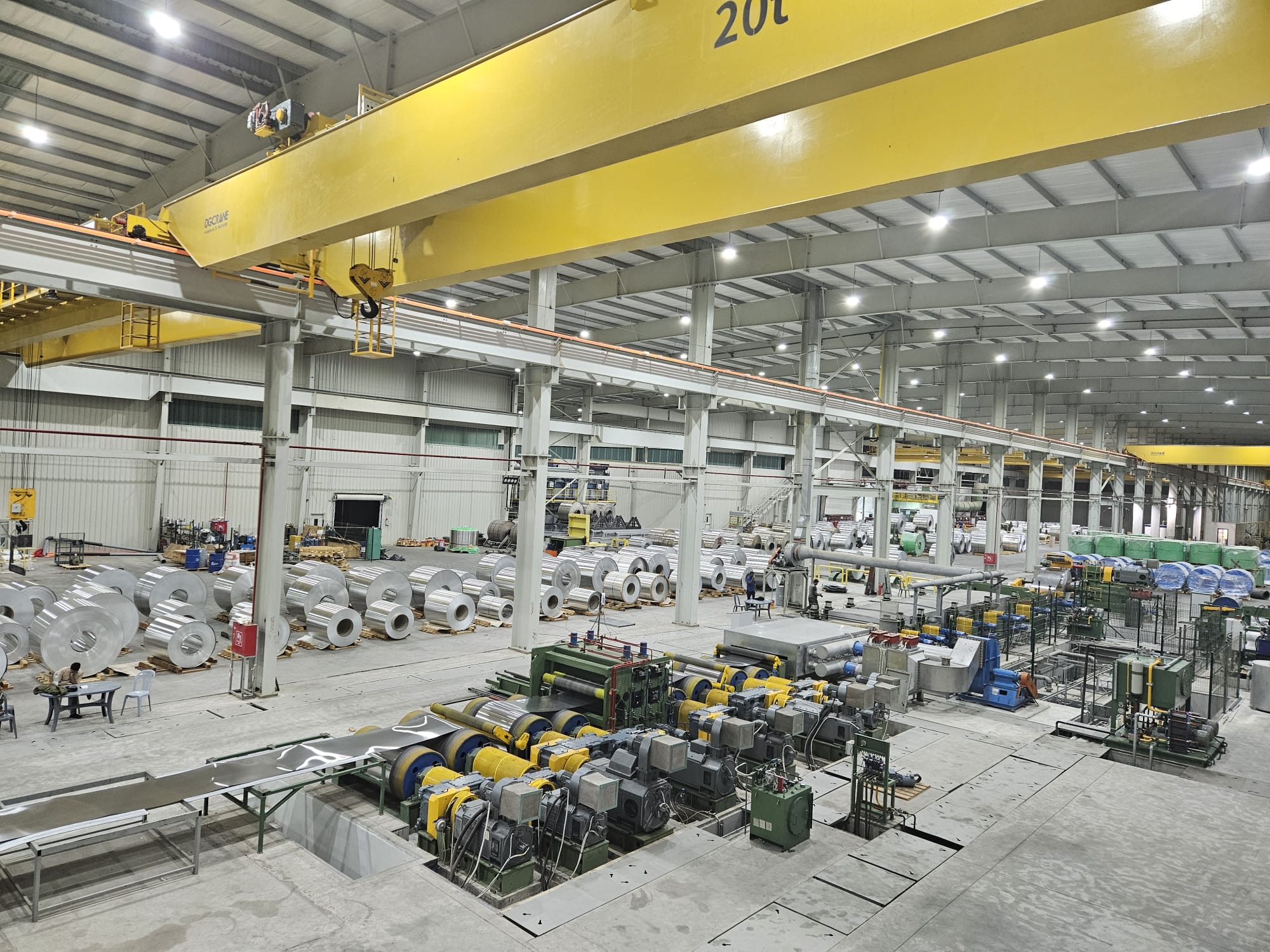 Production hall at Orbit's Aqaba plant with an overhead crane above rows of aluminum coil